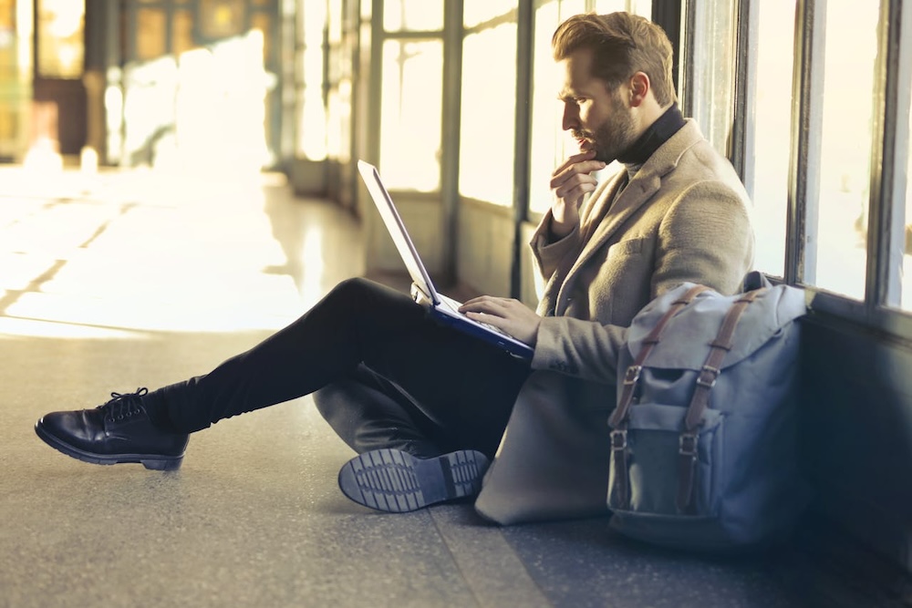 Man waiting for his flight at an airport